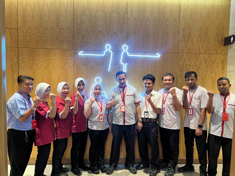 Sunway Pyramid cleaning crew posing together inside the mall